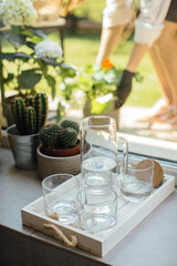 Glasses of water on the windowsill, still life.