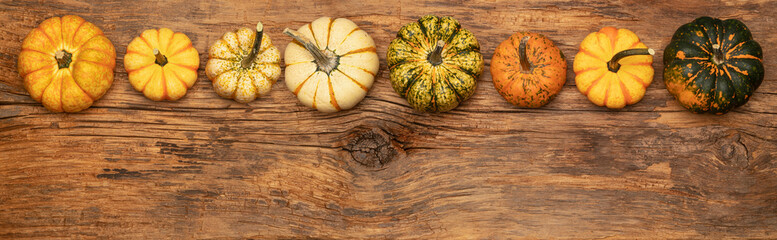 Pano image of gourds on an old farm table