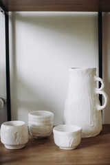 Interior photo, shelves with plants and decor.