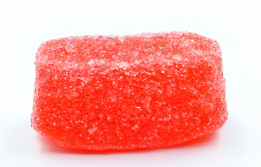 A strawberry gummy with sugar on white background