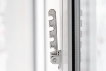 Close-up shot of a double-glazed plastic door frame, one-way balcony window handle,PVC window latch...
