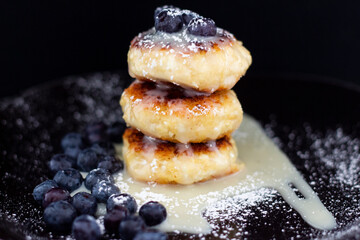 Cottage cheese pancakes with blueberries and condensed milk