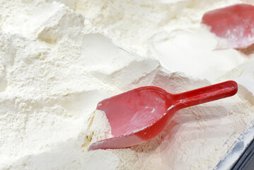 Lots of flour and a red spatula
