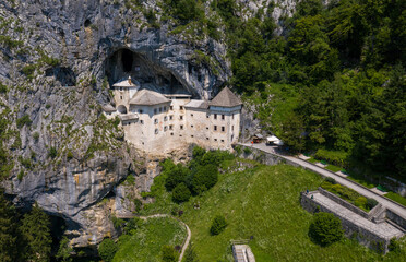 Predjama Castle in Slovenia, Europe. Renaissance castle built within a cave mouth in south central Slovenia, in the historical region of Inner Carniola. It is located in the village of Predjama