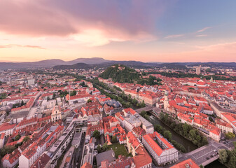 Obraz premium Graz Cityscape in Austria. Graz is the capital city of the southern Austrian province of Styria. At its heart is Hauptplatz, the medieval old town’s main square. Beautiful Sunset Light