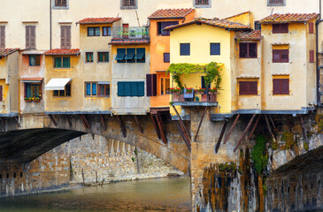 Ponte Vecchio over Arno river close-up, Florence, Italy. Old bridge with shops.