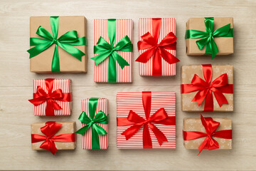 Gift boxes on wooden background, top view