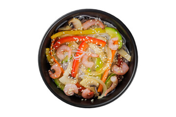 Noodles wok, with vegetables, herbs and sesame. In a black round plate. On a white background.