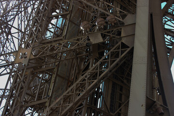 Obraz premium The iron construction of the Eiffel tower. Details of the construction of the Eiffel tower 