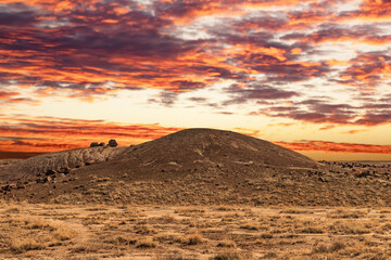 Fototapeta na wymiar Sundown with special rocks strewn around the park, Petrified National Forrest, AZ, USA