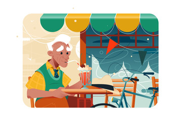 Old man sitting at cafe and drinking cocktail