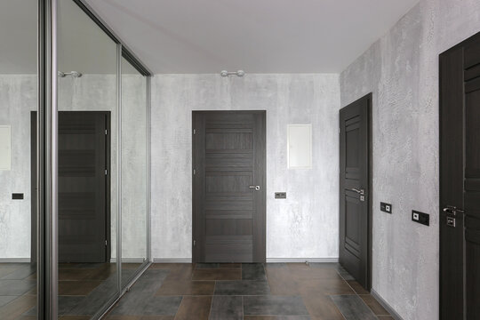 Interior doors in the hallway and sliding wardrobe with mirror