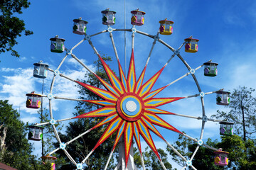 A colorful ferris wheel, front view