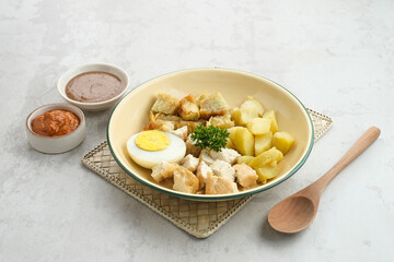 Batagor, Indonesian food made from fried fish dumpling, tofu, egg and potatoes with peanut sauce. 

