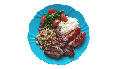 Traditional Brazilian food dish with barbecue, beans, rice and salad