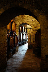 An underground wine cellar in Tuscany - obrazy, fototapety, plakaty