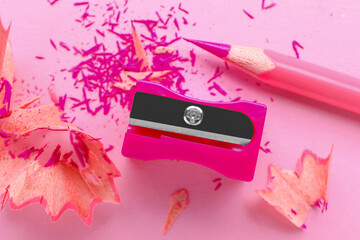 Pink pencil, sharpener and shavings on light background, flat lay - Powered by Adobe