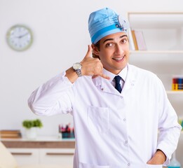 Young male doctor otolaryngologist working at the hospital