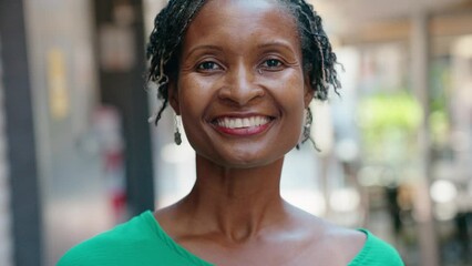 Middle age african american woman smiling confident standing at street - Powered by Adobe
