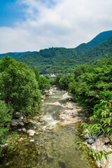Fototapeta na wymiar Wild stream brook through through the rocks of a mountain