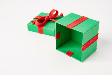 Present. Gift box with a bow. New Year's surprise. Red and green box with a gift