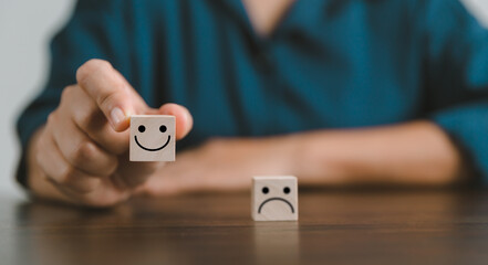 Satisfaction survey concept. Customer services best excellent business rating experience. Hand of business chooses a smile face on wood block circle. 5 Star Satisfaction. People feel great product.