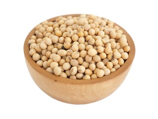 Soybeans in wooden bowl on white background. Top view photo, blurred.