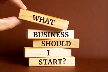Wooden blocks with words 'What Business Should I Start?'.