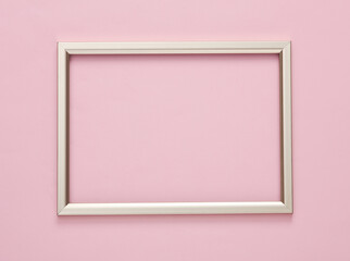 Golden frame on pink background