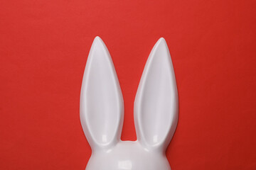 Bunny ears sex shop mask on red background