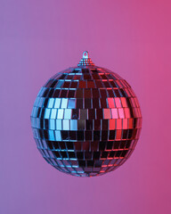 Disco ball floating in the air, isolated in blue-red neon gradient light. Levitating objects. Party...