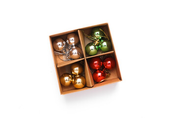Set of Christmas balls in a box on a white background