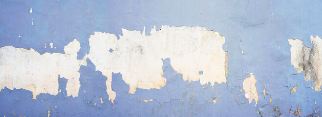 Peeling wall texture for background and wallpaper. Abstract rough wall pattern panoramic dimensions.