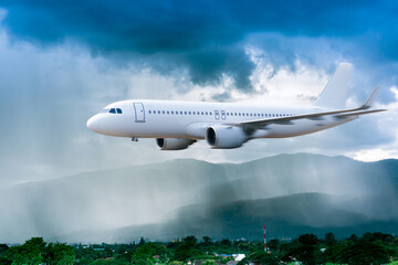 Fototapeta na wymiar Airplane in the sky with rain over mountain, The plane flies in terrible thunderstorm,Concept of climate weather