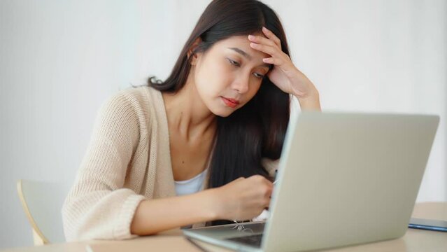 Office syndrome. Overworked tired young asian woman feeling headache, having eyesight problem after computer laptop work. Stressed young woman suffering from fatigue at home