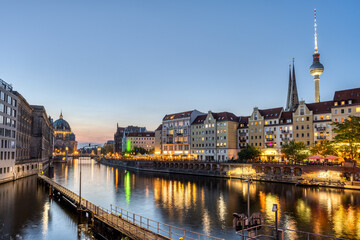 The Nikolaiviertel, the river Spree and the Cathedral in Berlin after sunset © elxeneize