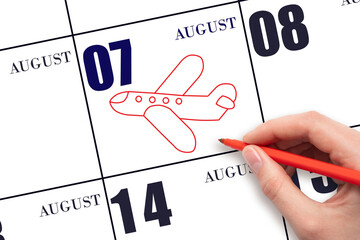 A hand drawing outline of airplane on calendar date 7 August. The date of flight on plane.