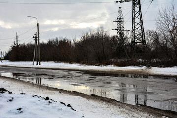 Damaged asphalt road after winter.