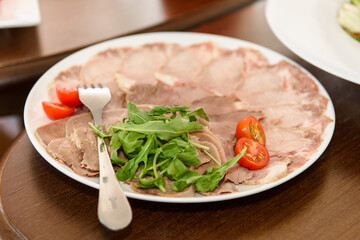 Salads are varied on the festive table. Delicious food to treat guests.