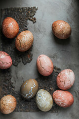 Beautiful Easter eggs dyed with natural ingredients. Pink vintage eggs decorated with copper golden paint and cracks.