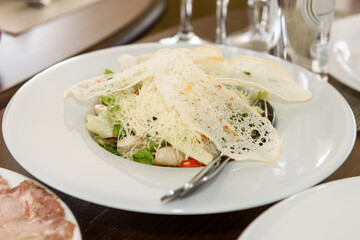 Salads are varied on the festive table. Delicious food to treat guests.