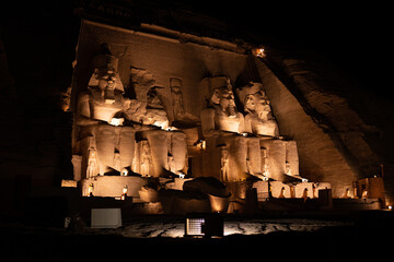 Light illuminated the entrance of an egyptian temple at night