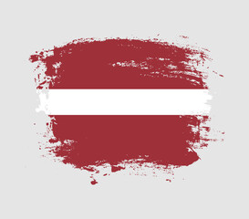 Elegant grungy brush flag with Latvia national flag vector