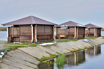 Bungalows on the river bank on a cold autumn day