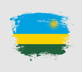 Elegant grungy brush flag with Rwanda national flag vector