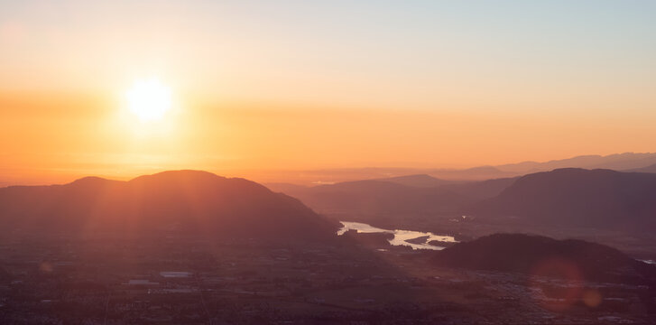 Fraser Valley, River and Canadian Mountain Landscape during sunset. Taken from Elk Mountain, Chilliwack, East of Vancouver, BC, Canada. Nature Background