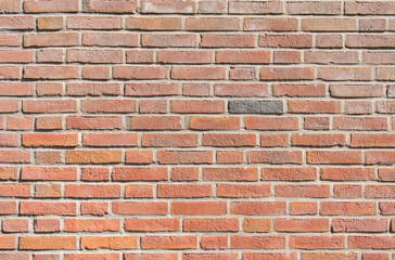 Old brick wall, orange, yellow, brown. Wall of an old vintage house. photo background.