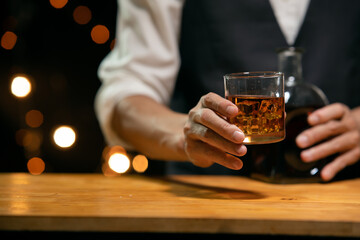 Barman pouring whiskey whiskey glass beautiful night