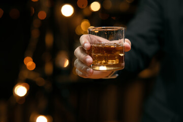 Barman pouring whiskey whiskey glass beautiful night