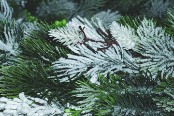 Artificial fir tree branches with needles close up. Christmas decoration